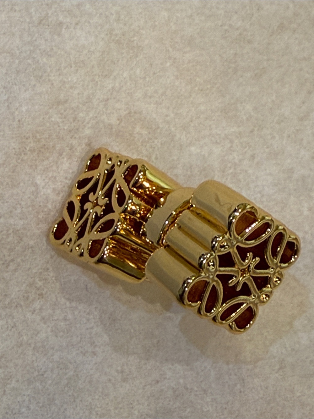 Gold Tone Ribbed Logo Stud Earrings - Picture 3 of 6